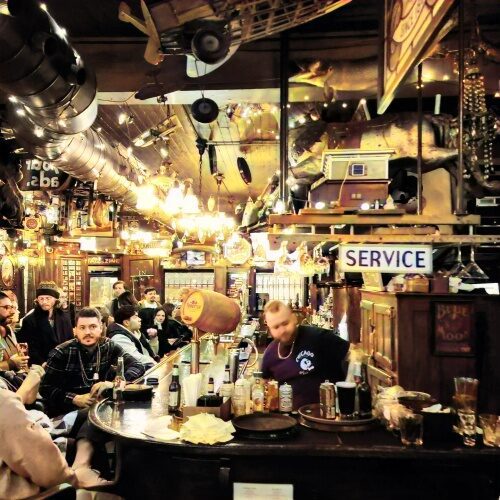 Vibrant bar atmosphere with patrons - Green Door Tavern Chicago | River North Bar & Restaurant - Green Door Tavern Chicago | River North Bar & Restaurant Vibrant bar atmosphere with patrons